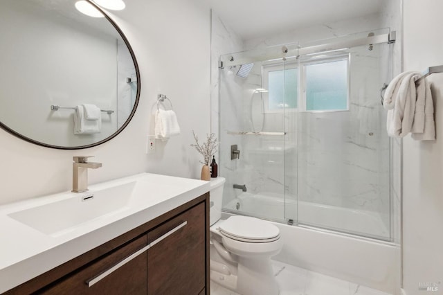 full bathroom with enclosed tub / shower combo, vanity, and toilet