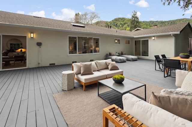 wooden deck featuring outdoor lounge area