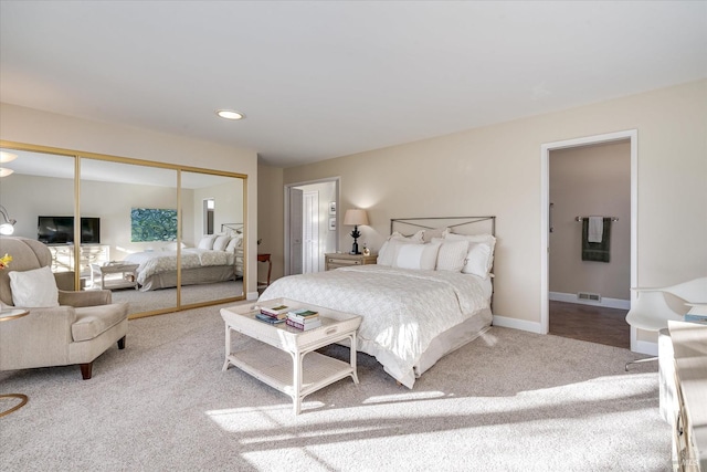 bedroom with carpet flooring and a closet