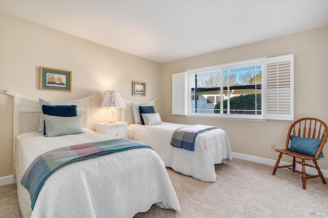 bedroom featuring light colored carpet