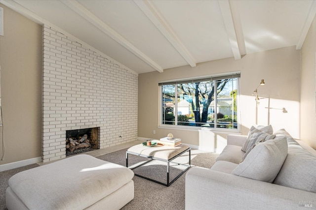 carpeted living room featuring a brick fireplace and vaulted ceiling with beams