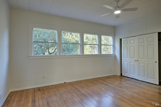 unfurnished bedroom with a closet and light hardwood / wood-style flooring