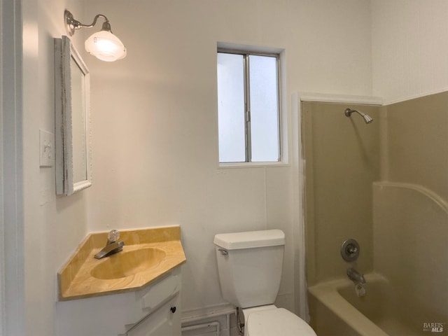 full bathroom featuring vanity, shower / washtub combination, and toilet