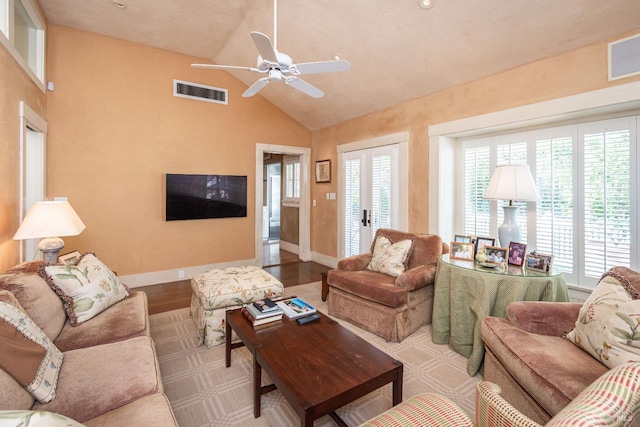 living room with high vaulted ceiling, light wood-type flooring, and ceiling fan