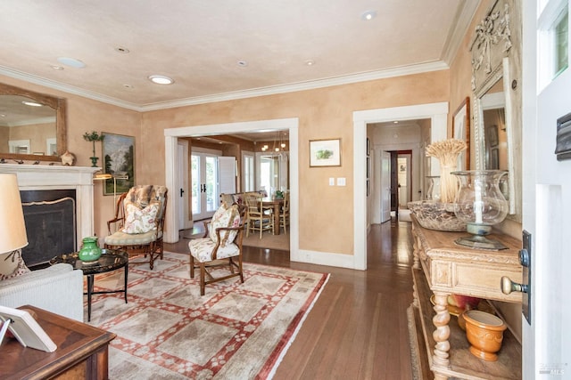 living room with crown molding and hardwood / wood-style flooring