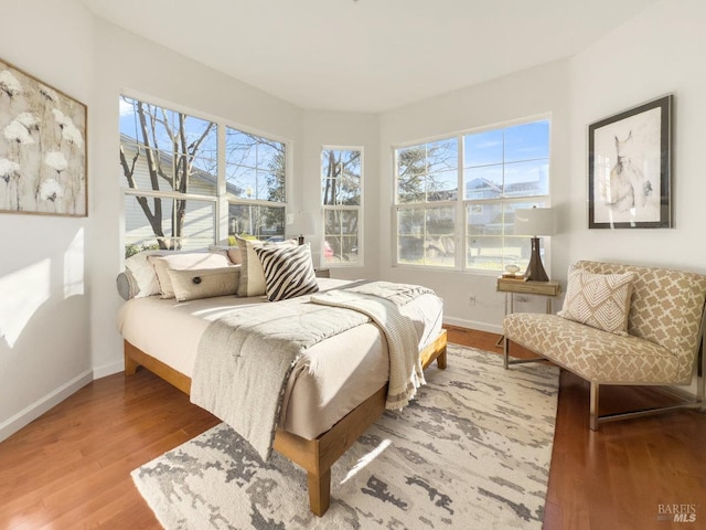 bedroom with hardwood / wood-style floors