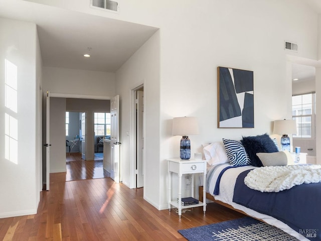 bedroom with dark wood-type flooring