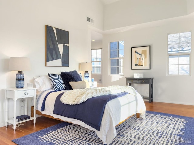 bedroom with hardwood / wood-style floors