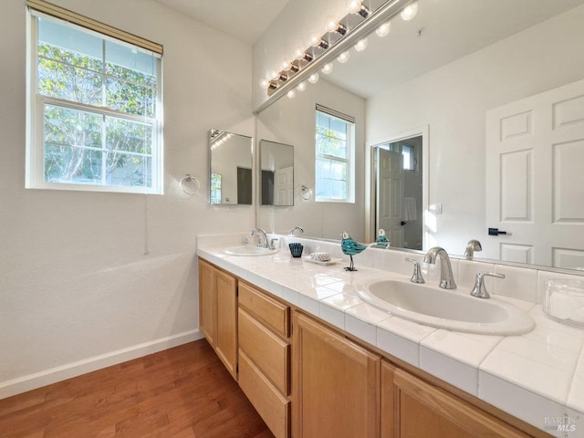 bathroom with vanity and hardwood / wood-style floors