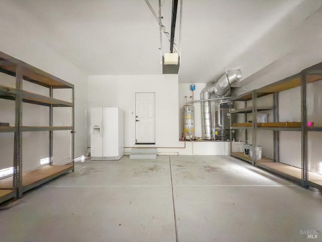 garage featuring a garage door opener, gas water heater, and white fridge with ice dispenser