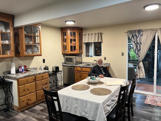 dining room with dark wood-type flooring and sink