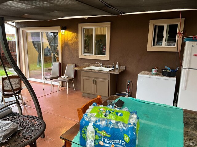 view of patio with sink and an outdoor kitchen