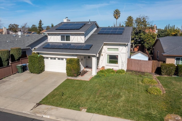 view of front of home featuring a front yard and solar panels