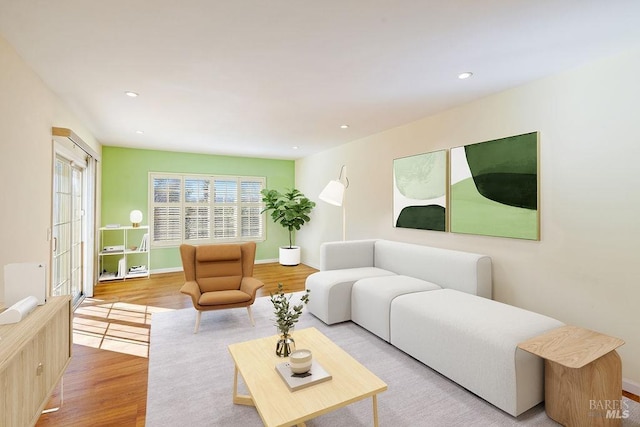 living room with light hardwood / wood-style flooring