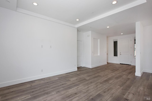 spare room with hardwood / wood-style floors