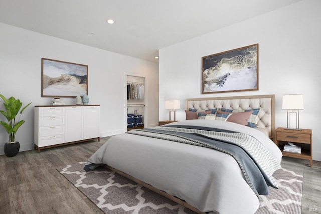 bedroom with dark hardwood / wood-style floors