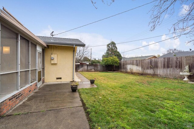 view of yard with a patio area