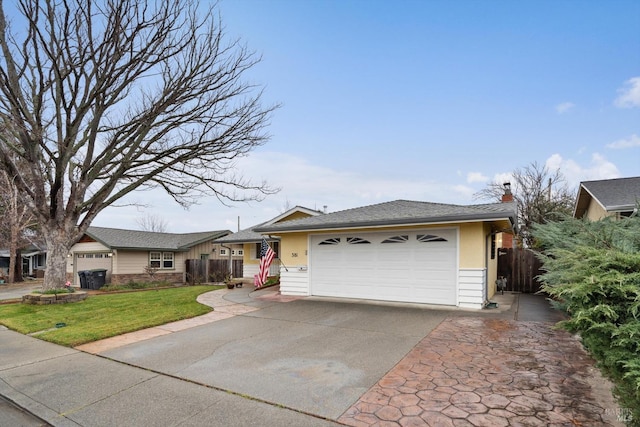 ranch-style house with a garage and a front yard