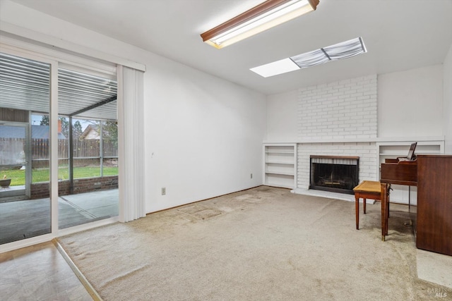 unfurnished living room featuring carpet and a fireplace