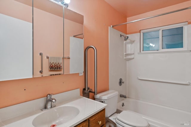 bathroom with tub / shower combination, toilet, and vanity