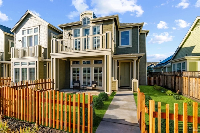 townhome / multi-family property featuring a balcony and a patio