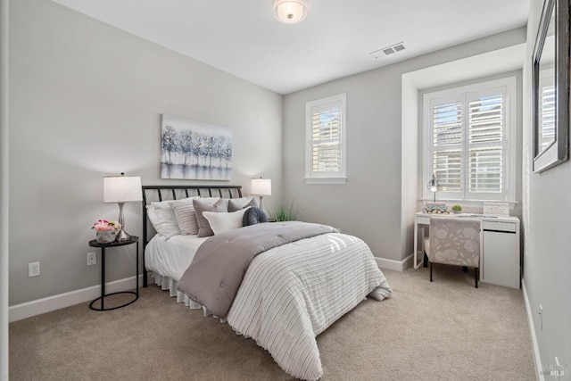 bedroom with light carpet