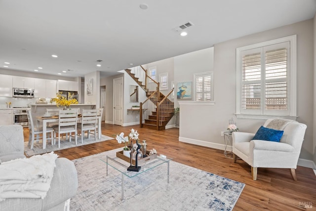 living room with light hardwood / wood-style floors