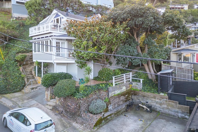 view of side of property with a balcony