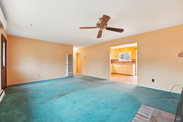 unfurnished living room with ceiling fan and carpet floors