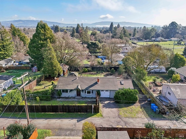 birds eye view of property with a mountain view