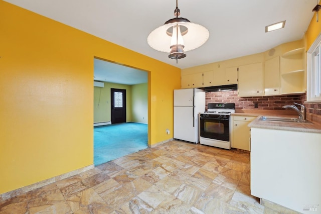 kitchen with pendant lighting, sink, a baseboard radiator, range with gas cooktop, and white fridge