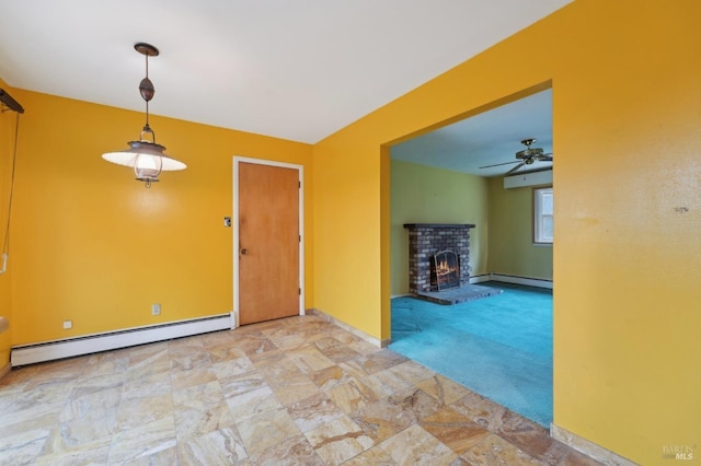 unfurnished living room with baseboard heating, ceiling fan, light carpet, and a brick fireplace