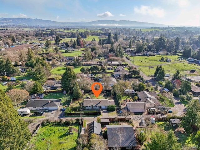 birds eye view of property featuring a mountain view