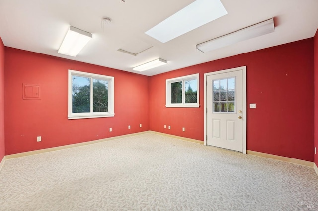 carpeted spare room with a wealth of natural light