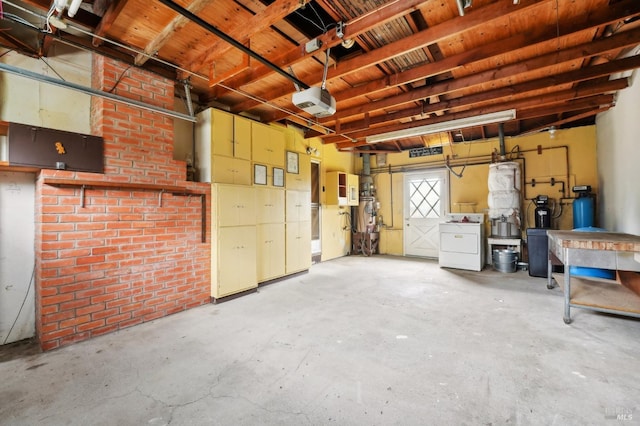 garage with a garage door opener and washing machine and clothes dryer