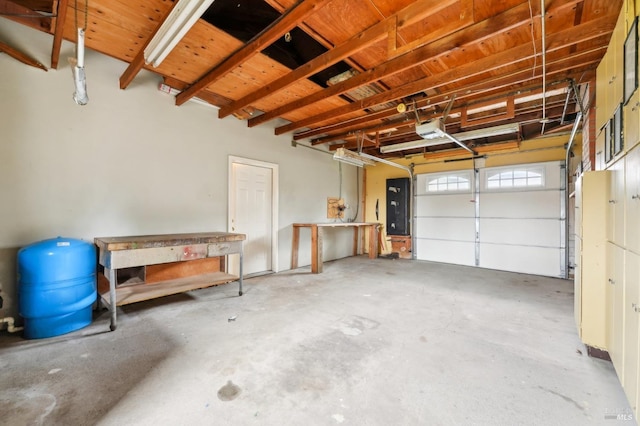 garage featuring a garage door opener and electric panel