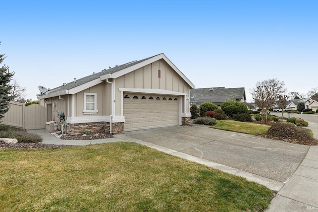 single story home featuring a garage and a front lawn