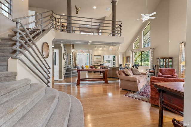 3057 Saint Helena Hwy N, Saint Helena, CA 94574 - living room featuring a towering ceiling, stairway, light wood-style flooring, a ceiling fan, and recessed lighting