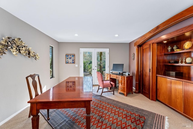 office space with light colored carpet and french doors