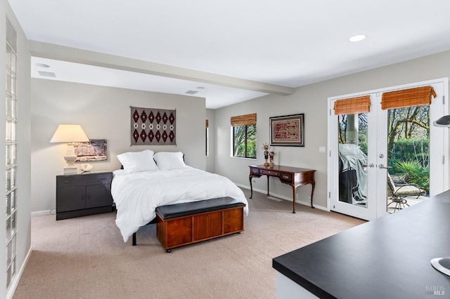 carpeted bedroom featuring french doors, beam ceiling, and access to outside