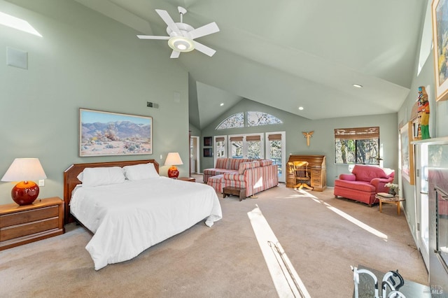 bedroom featuring ceiling fan, high vaulted ceiling, and light carpet