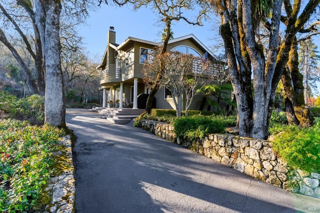 view of front of house featuring a balcony