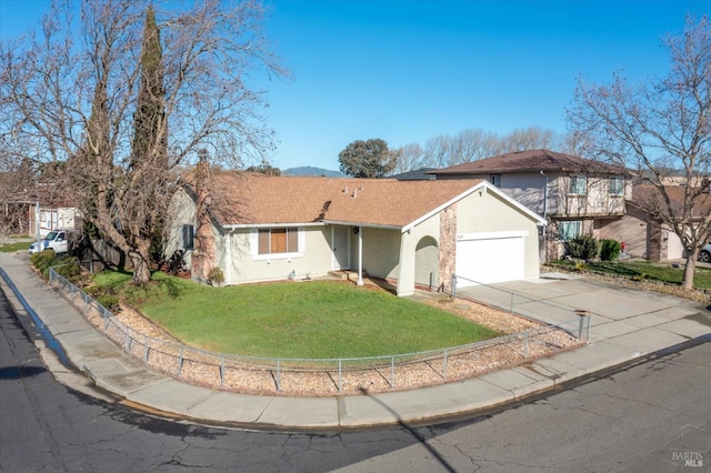 view of front of property featuring a garage and a front lawn