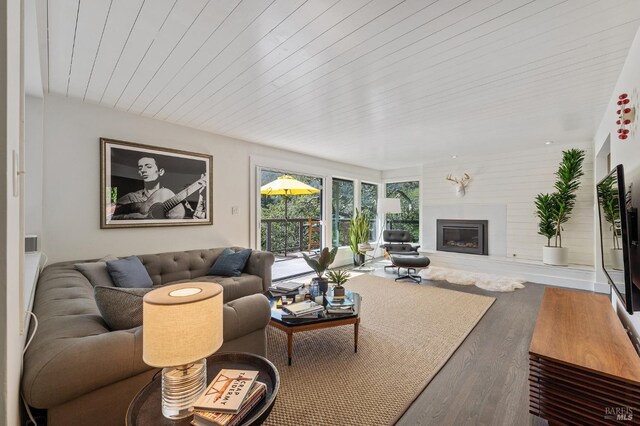 sunroom featuring wood ceiling and a wealth of natural light