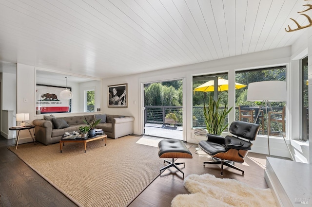 sunroom featuring wood ceiling and a wealth of natural light