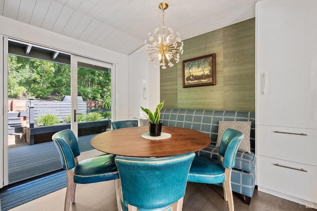 dining room with an inviting chandelier, hardwood / wood-style flooring, vaulted ceiling, and wooden ceiling