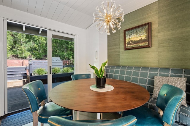 dining room with an inviting chandelier, wood ceiling, and vaulted ceiling