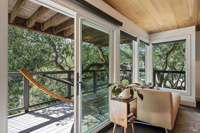 sunroom featuring wood ceiling