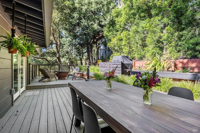 wooden deck featuring grilling area