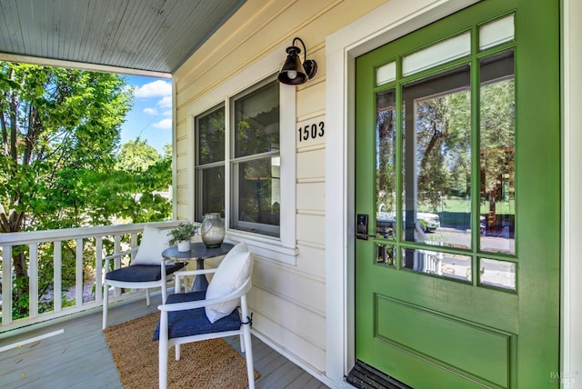 entrance to property featuring covered porch